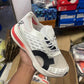 ON CLOUDBOOM STRIKE WHITE ORANGE